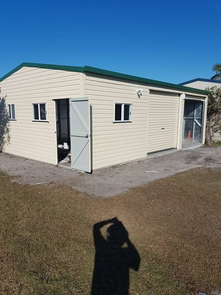 Shed with pitched green roof