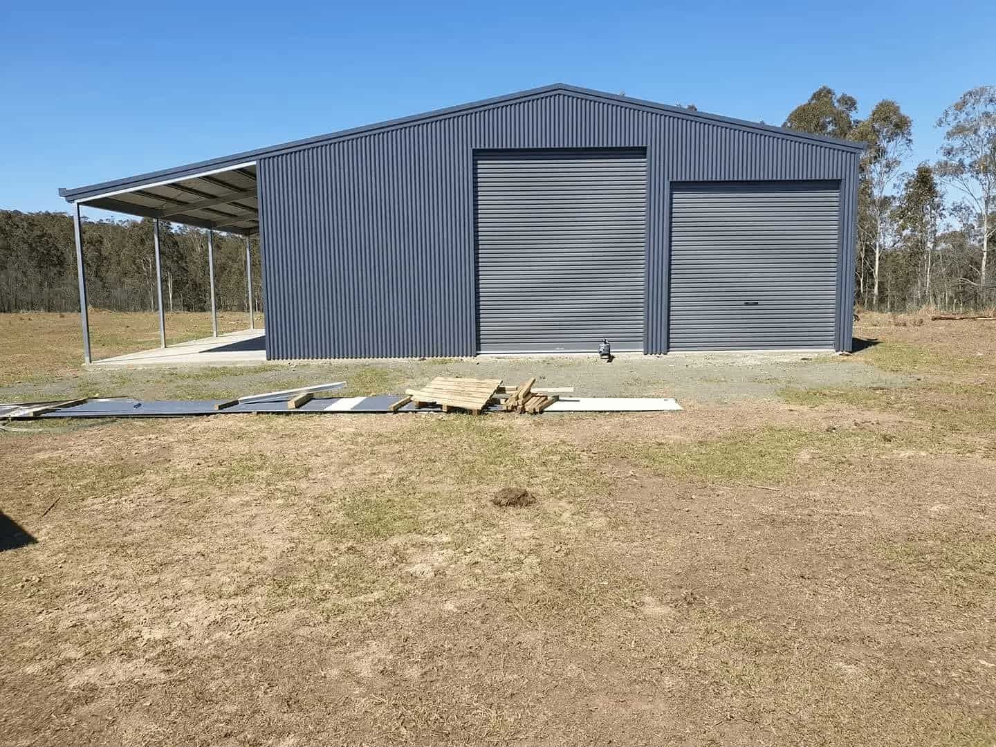 Grey shed with wide carport awning